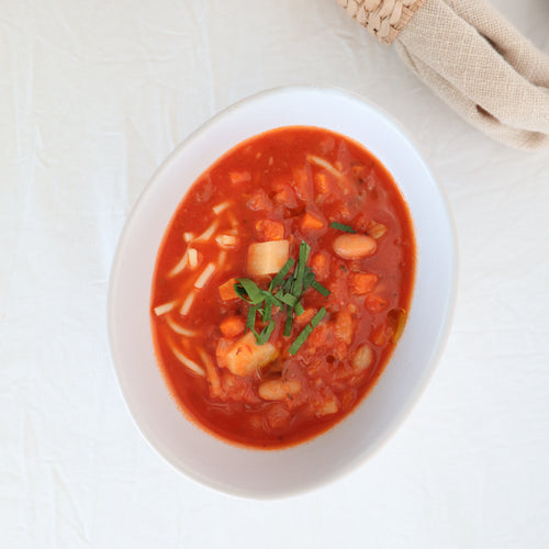 Rich minestrone soup with vegetables and noodles prepared by Fresh Meals Delivered
