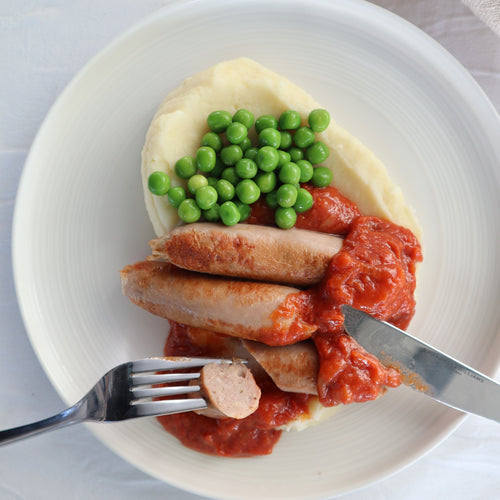 Gourmet Bangers and Mash with tomato and onion gravy